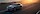 Ford Mustang Mach-E tengerparti úton halad naplementében